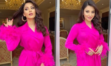 Urvashi Rautela Radiates Charm in Elegant Silk Feather Fuchsia Pink Dress