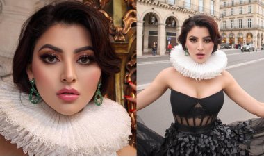 Urvashi Rautela Glares in a Black Gown and Eye-Catching Neck Ruffle on the Streets of Paris